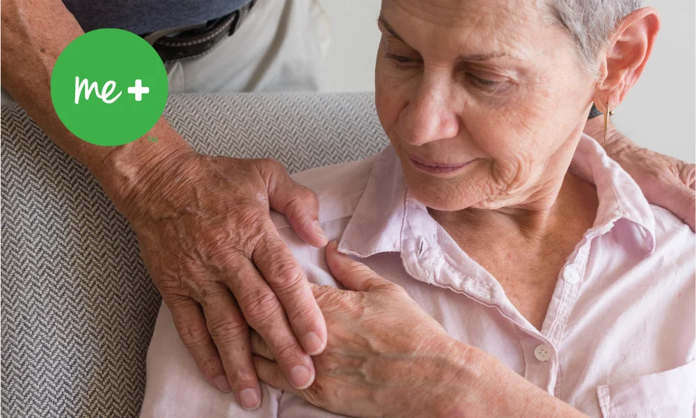 woman sitting receiving care from caregiver