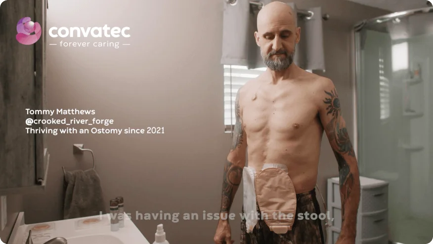 a man with tattoos in a bathroom