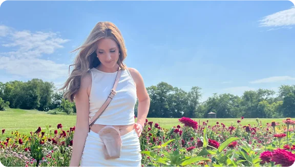 a person standing in a field of flowers