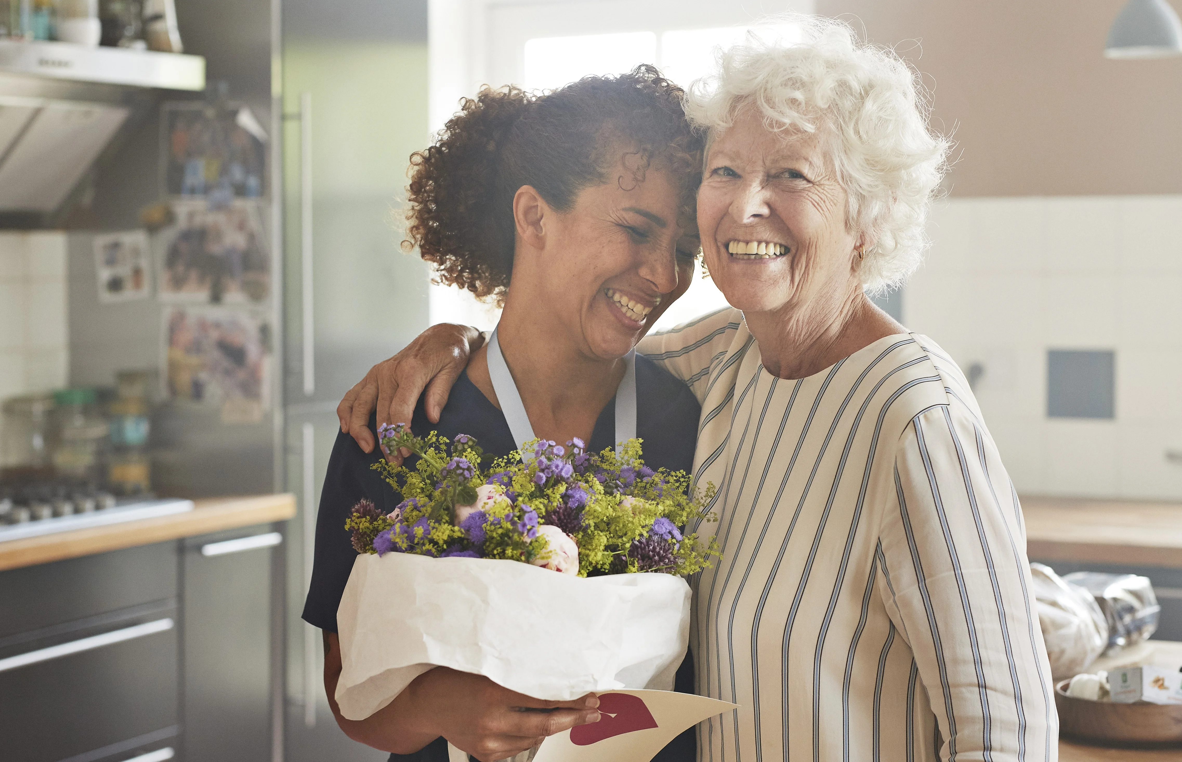 a man and woman holding flowers