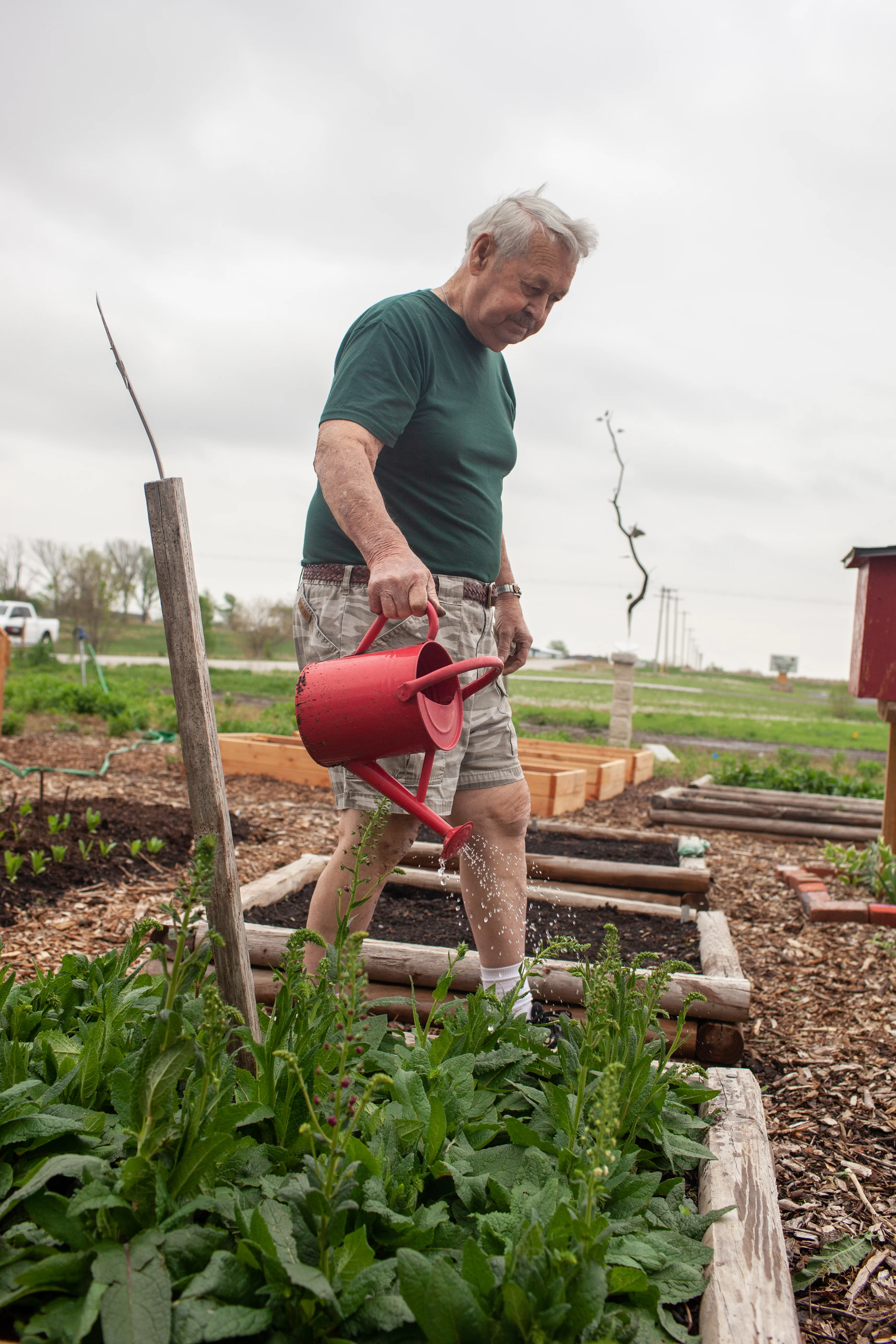 a man with a watering can
